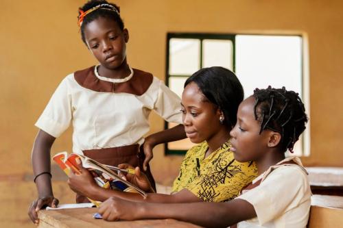 teacher-helping-kids-class_23-2148892530 (1)